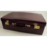 A Finnigans Manchester leather suitcase, with gilt metal mounts, 19.5ins x 13ins x 6ins