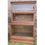 Globe Wernicke and Co Ltd, an oak three section bookcase, with glazed fronts, height 57ins x width