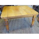 An oak dining table, raised on turned legs, 51ins x 47ins x height 29ins