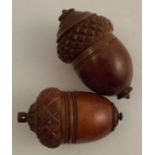 Two Antique treen nutmeg graters, formed as acorns with screw off bases, height 3ins