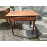 A Georgian country part elm side table, fitted with a frieze drawer and chamfered legs, width