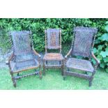 Two similar 17th century style cane back and seated armchairs, raised on turned legs united by