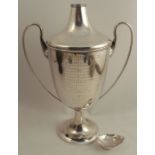 A Chinese silver covered two handled trophy cup, engraved with Chinese script, marked 90, maker