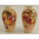 A pair of Royal Worcester vases, decorated half round with hand painted fruit by Roberts, shape