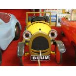 “Brum”, a yellow swing pedal car., Size 36” x 16”, having solid rubber tyres