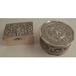 A Margrett Bangkok silver cigarette box, the top decorated with a Deity and scrolls, 3ins x 4.