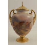 A Royal Worcester covered pedestal vase, the front decorated with three Highland cattle in landscape