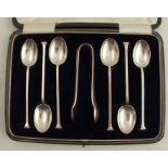 A cased set of six silver coffee spoons, together with sugar tongs, Sheffield 1923, weight 2oz