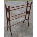 A 19th century Aesthetic Movement walnut clothes rail