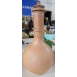 A Wedgwood terracotta style covered vase, the top has multiple chips, height 9ins