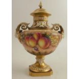 A Royal Worcester twin handled covered mask vase, decorated all round with hand painted fruit by