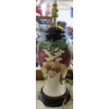 A Moorcroft Pottery lamp base, of baluster form, with wooden stand, height 16ins