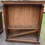 A Edwardian mahogany bookcase, with three adjustable shelves, having carved decoration, raised on
