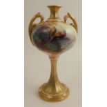 A Royal Worcester vase, raised on an inverted trumpet shaped pedestal, decorated with pheasants by
