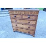 A 19th century oak chest, of two short over three long drawers, raised on bracket feet, width