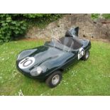 A replica D – Type Jaguar, approx half scale, with petrol driven engine, in British racing green,