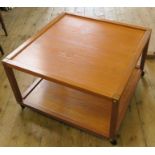 A mid-century Danish two tier square teak coffee table, by Nordisk Andels-Eksport, paper label to