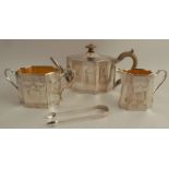 A matched silver three piece tea set, of shaped oval form with engraved decoration, tea pot London