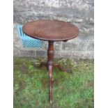A 19th century circular oak occasional table, raised on a tripod base, diameter 18.75ins x height
