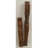 Two antique oak carvings, one carved with a mans head with moustache and fruit, height 18.25ins, the
