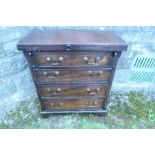 A mahogany fold over bachelor's chest, fitted with four graduated drawers, raised on bracket feet,