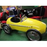 A yellow Ferrari swing pedal car, with solid rubber tyres, approx. 48” x 27”