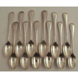 A set of twelve silver teaspoons, with bead edge, London 1897, weight 6oz