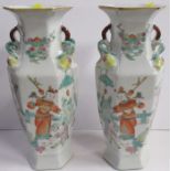 A pair of Oriental hexagonal vases, of baluster form, decorated with figures, height 9.5ins