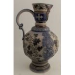 A German Westerwald stoneware ewer, decorated in blue and brown, height 15ins