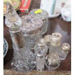 Nine various hallmarked silver and glass dressing table bottles and jars