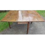 An Antique oak drop leaf table, with swing leg action, 45ins x 57ins, height 29ins