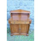 A 19th century mahogany chiffonier, with shelf over, fitted with a drawer, having two cupboard doors
