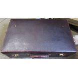 A leather suitcase, 15ins x 24ins x 7.5ins