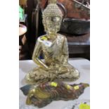 A metal buddha, together with a reclining example