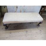 A foot stool, raised on cabriole legs, width 38ins