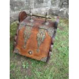 An Edwardian coal bucket and shovel, with brass carrying handle and straps, 13ins x 20ins x height