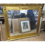 A gilt framed over mantel mirror, with swag and column decoration, overall size 39ins x 43ins,