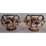 A pair of Derby porcelain squat vases, decorated with a version of the Imari pattern, having mask