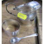 A hallmarked silver jug, together with a condiment spoon and napkin ring, total weight 2oz