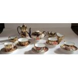 A collection of Royal Crown Derby miniature teaware, all decorated in a version of the Imari