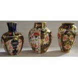 Three various Royal Crown Derby vases, all decorated in different versions of the Imari pattern,