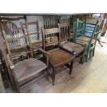 A large collection of chairs, including four painted chairs, 19th century style chairs, etc.