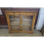 A 19th century burr walnut glazed cabinet, with ivory inlaid decoration, and ormolu mounts, the