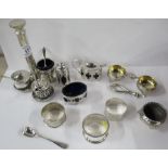 A collection of hallmarked silver, to include napkin rings and condiment pots