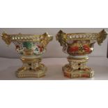 Two 19th century Derby porcelain pedestal vases, decorated in a version of the Imari pattern, height