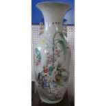An Oriental vase, decorated with figures in landscape to one side and script to the other, with