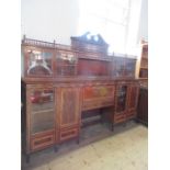 A late 19th century mahogany break front secretaire bookcase, having a long galleried top, with