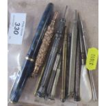 A collection of propelling pencils, a Conway Stewart pen etc