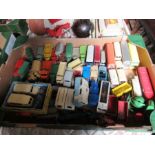 A box of unboxed Dinky Toys, including vintage cars, lorries, buses, caravans, etc.