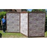 A large oak framed three fold screen with decoration to the top, each panel 90ins x 55.5ins